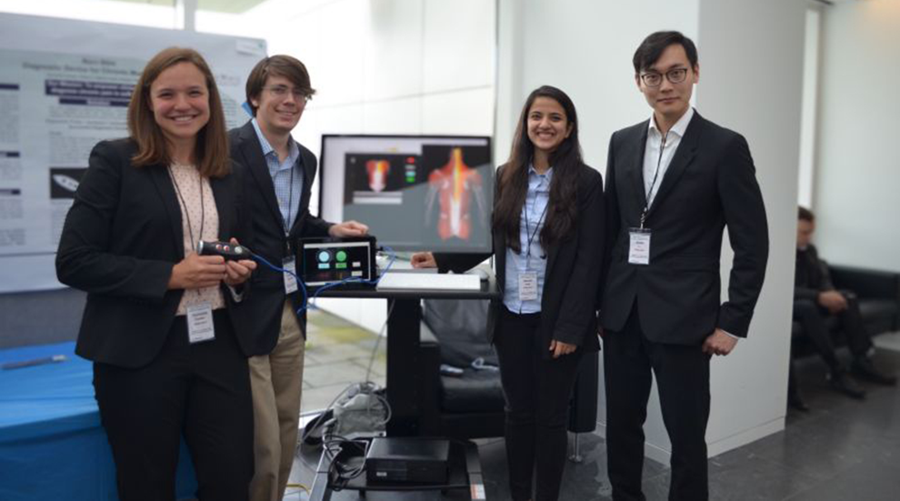 Qiwei Li with student colleagues and Noci-Stim device at 2019 M.Eng. Industry Day